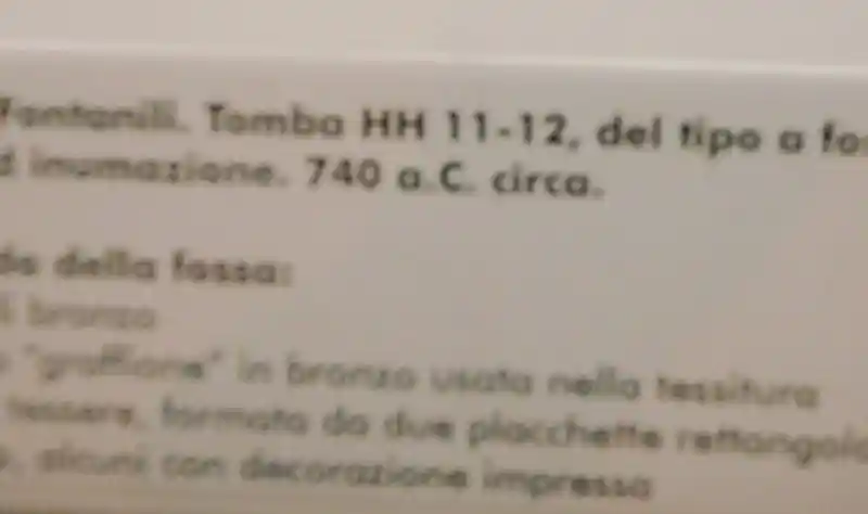 Description of pre-Christian cross carved on a clay pot, tomb a type of burial, located at National Etruscan Museum of Villa Giulia